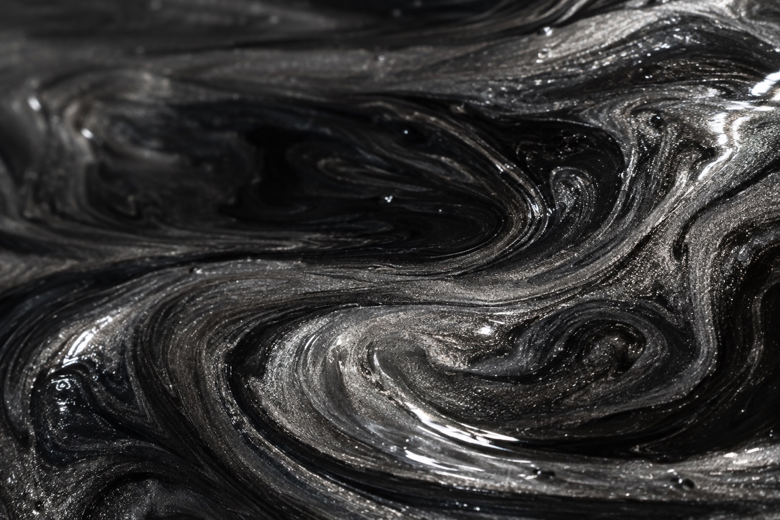 Pearlescent metallic pigment swirling through a clear resin pour